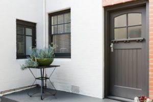 a brick home that's painted white